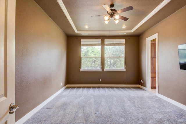 10242 Brangus Rd, Driftwood, TX 78619 - carpeted spare room with a tray ceiling, a ceiling fan, crown molding, and a textured wall