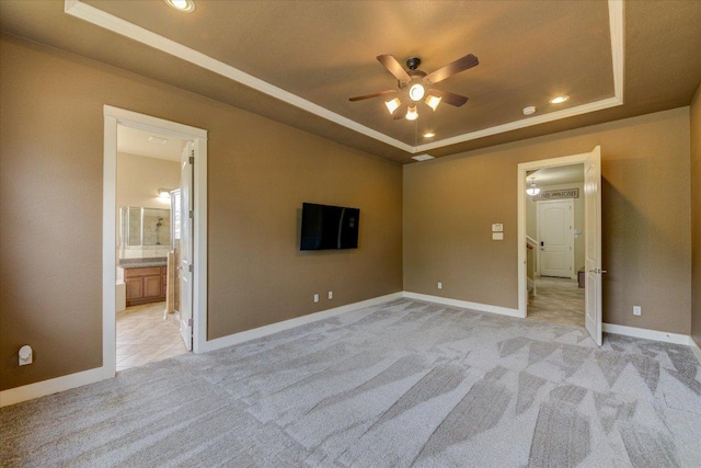 10242 Brangus Rd, Driftwood, TX 78619 - empty room with a tray ceiling, a ceiling fan, light carpet, and recessed lighting