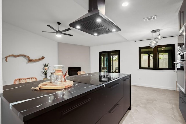 3503 Gable Dr, Austin, TX 78759 - kitchen featuring wall chimney exhaust hood, black electric stovetop, modern cabinets, ceiling fan, and decorative light fixtures