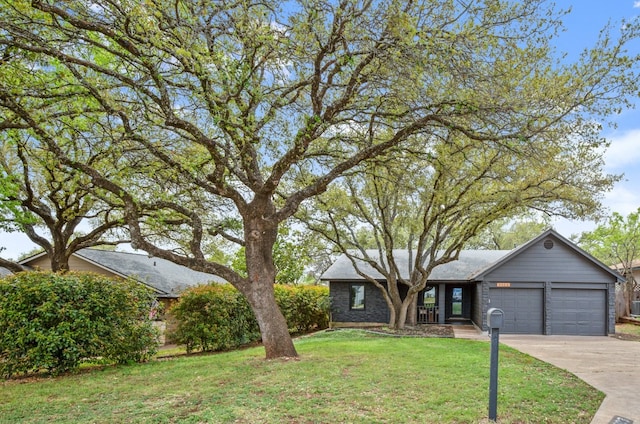 3503 Gable Dr, Austin, TX 78759 - view of front of house featuring a garage, a front lawn, and concrete driveway