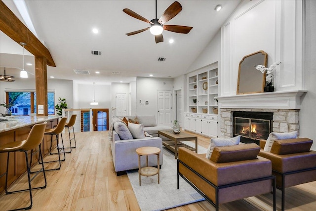 1607 Bay Hill Dr, Austin, TX 78746 - living room with a fireplace, a ceiling fan, light wood-style flooring, recessed lighting, and high vaulted ceiling