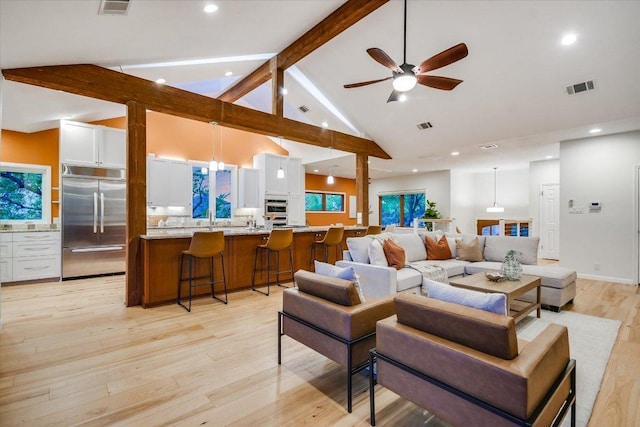 1607 Bay Hill Dr, Austin, TX 78746 - living area with beam ceiling, light wood finished floors, ceiling fan, high vaulted ceiling, and recessed lighting