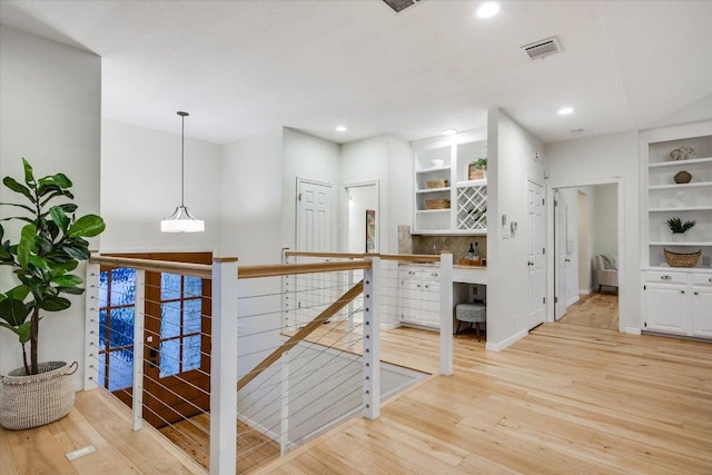 1607 Bay Hill Dr, Austin, TX 78746 - hallway featuring an upstairs landing, light wood-style floors, recessed lighting, and built in shelves