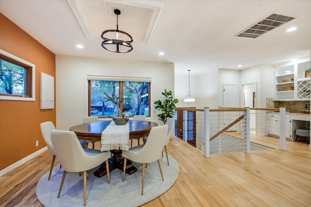 1607 Bay Hill Dr, Austin, TX 78746 - dining room featuring light wood-type flooring, a chandelier, recessed lighting, and baseboards
