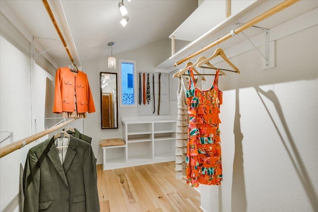 1607 Bay Hill Dr, Austin, TX 78746 - walk in closet featuring wood finished floors and lofted ceiling