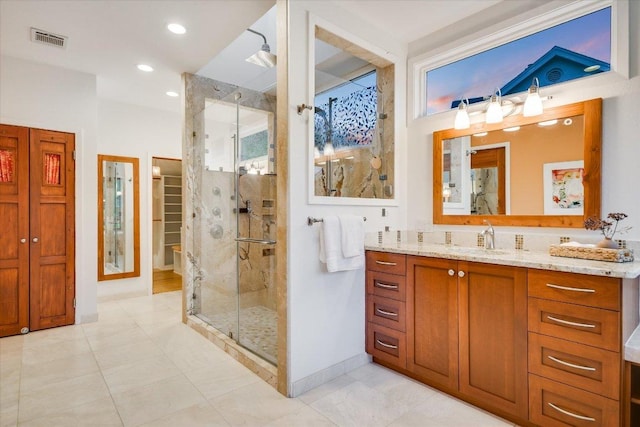 1607 Bay Hill Dr, Austin, TX 78746 - full bathroom featuring a shower stall, vanity, a spacious closet, and recessed lighting