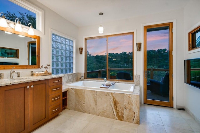 1607 Bay Hill Dr, Austin, TX 78746 - full bath with tile patterned flooring, a bath, vanity, and baseboards