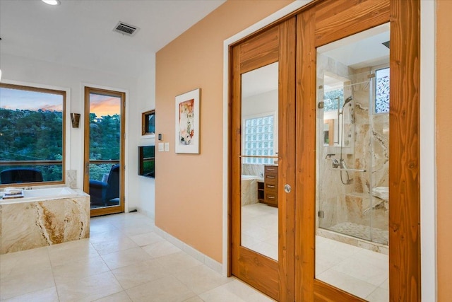 1607 Bay Hill Dr, Austin, TX 78746 - hallway featuring light tile patterned floors and baseboards