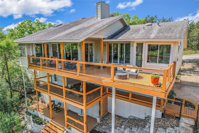 1607 Bay Hill Dr, Austin, TX 78746 - rear view of house with a shingled roof, a chimney, and a wooden deck