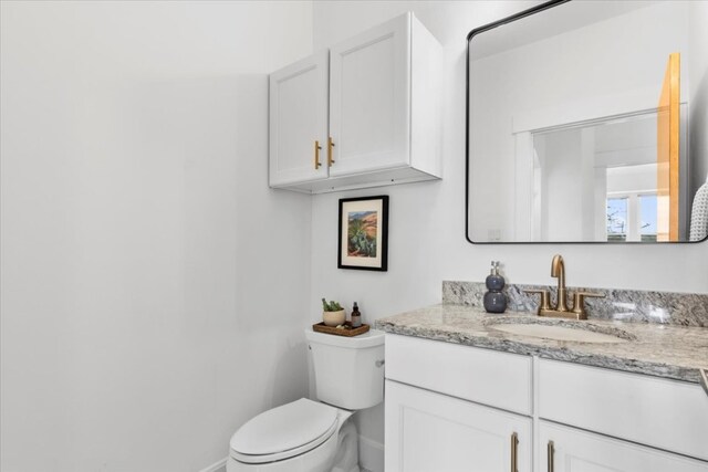 510 W 22nd St, Georgetown, TX 78626 - bathroom with baseboards, toilet, and vanity