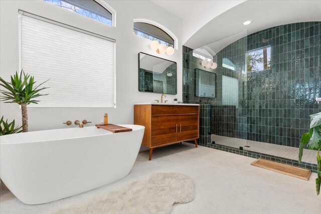 510 W 22nd St, Georgetown, TX 78626 - full bathroom with a freestanding tub, a walk in shower, and vanity