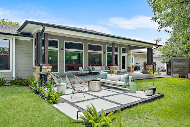 510 W 22nd St, Georgetown, TX 78626 - rear view of property featuring an outdoor hangout area, a patio, and a lawn