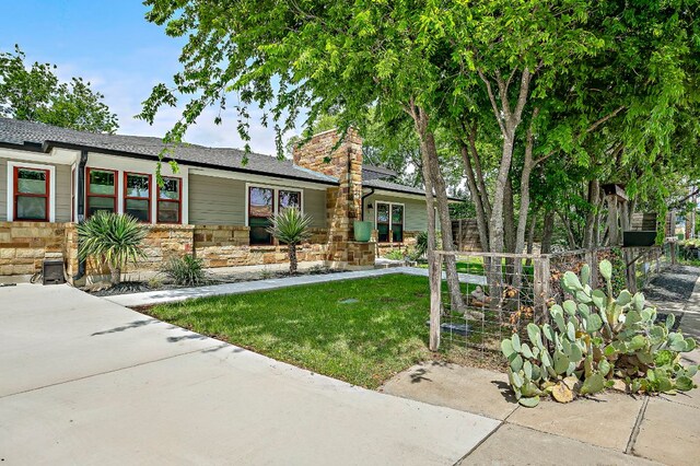 510 W 22nd St, Georgetown, TX 78626 - view of front facade featuring stone siding and a chimney
