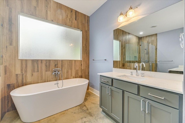 1811 Cedar Ave, Austin, TX 78702 - full bath featuring vanity, a freestanding tub, a stall shower, baseboards, and wooden walls
