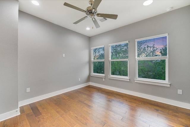 1811 Cedar Ave, Austin, TX 78702 - unfurnished room featuring wood-type flooring, baseboards, recessed lighting, ceiling fan, and a smoke detector