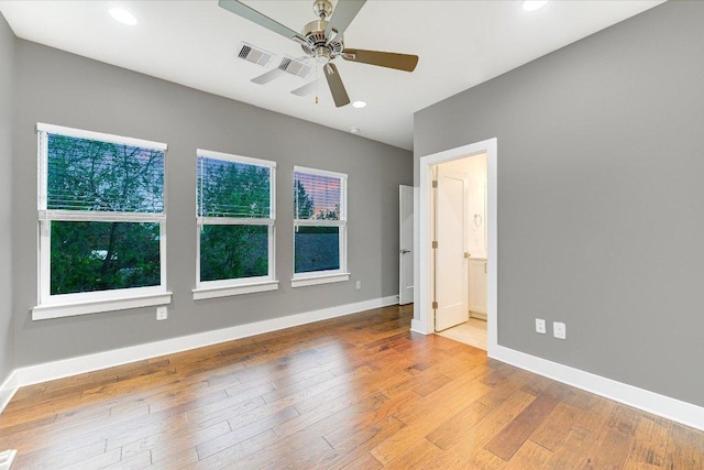 1811 Cedar Ave, Austin, TX 78702 - empty room featuring ceiling fan, baseboards, wood finished floors, and recessed lighting