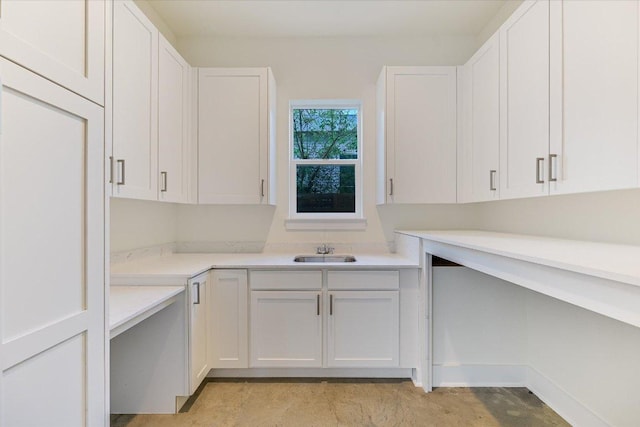 1811 Cedar Ave, Austin, TX 78702 - kitchen featuring a sink, white cabinets, and light countertops