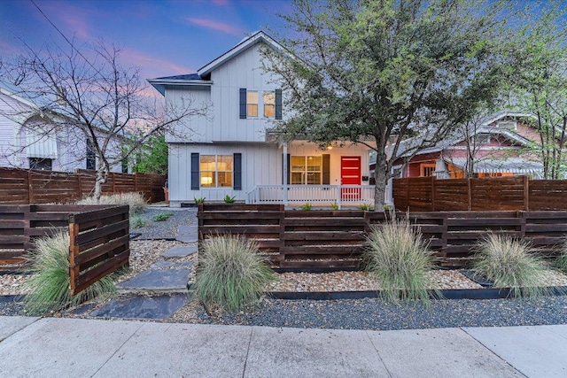 1811 Cedar Ave, Austin, TX 78702 - view of front facade with covered porch and board and batten siding