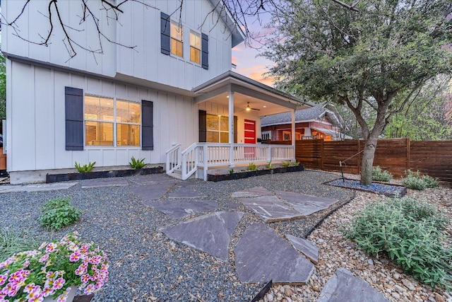 1811 Cedar Ave, Austin, TX 78702 - back of house at dusk with a porch and board and batten siding
