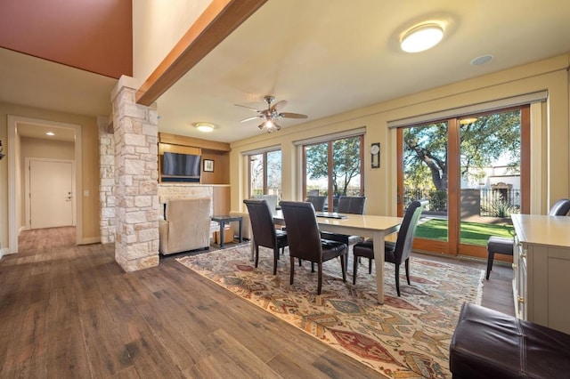 101 Knarr St, Austin, TX 78734 - dining room featuring dark wood finished floors, decorative columns, and ceiling fan