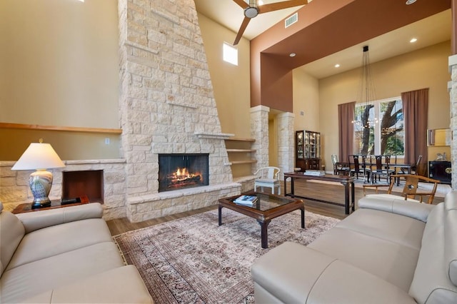 101 Knarr St, Austin, TX 78734 - living area with a towering ceiling, wood finished floors, an outdoor stone fireplace, and recessed lighting