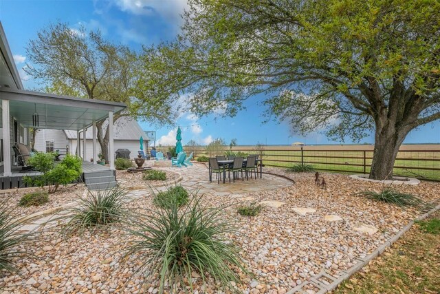 18190 Round Hall Rd, Holland, TX 76534 - view of yard featuring fence, outdoor dining space, and a patio area
