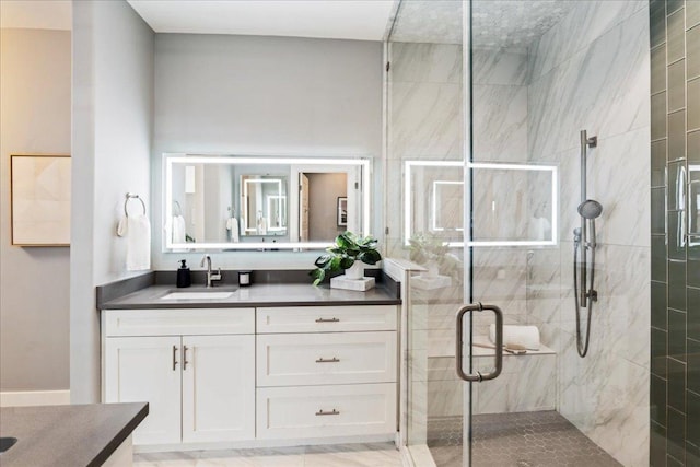 full bathroom featuring a stall shower and vanity