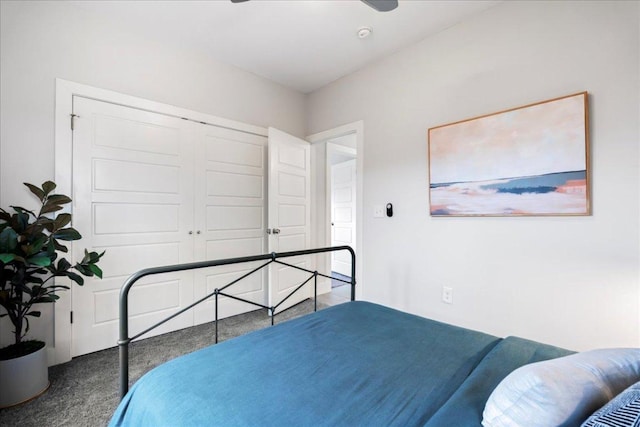 carpeted bedroom with a closet and ceiling fan