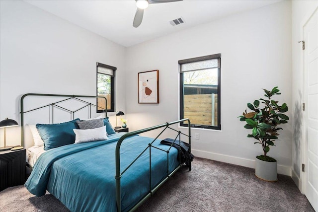 bedroom with carpet flooring, baseboards, and a ceiling fan