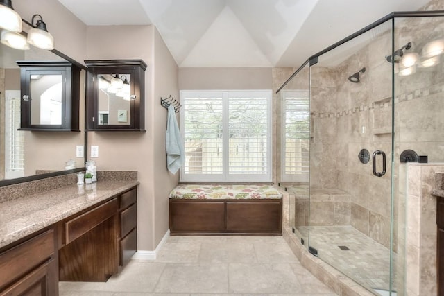 8016 Tahoe Parke Cir, Austin, TX 78726 - full bathroom featuring vanity, a shower stall, baseboards, lofted ceiling, and tile patterned floors