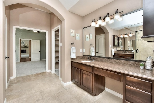 8016 Tahoe Parke Cir, Austin, TX 78726 - full bathroom with vanity, baseboards, and tile patterned floors