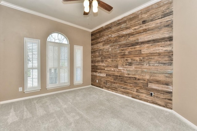 8016 Tahoe Parke Cir, Austin, TX 78726 - empty room with wood walls, a ceiling fan, carpet flooring, crown molding, and baseboards