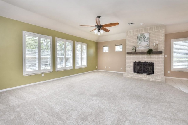 8016 Tahoe Parke Cir, Austin, TX 78726 - unfurnished living room featuring a ceiling fan, baseboards, a brick fireplace, and carpet floors