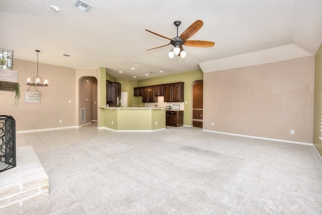 8016 Tahoe Parke Cir, Austin, TX 78726 - unfurnished living room with arched walkways, a ceiling fan, baseboards, and light colored carpet
