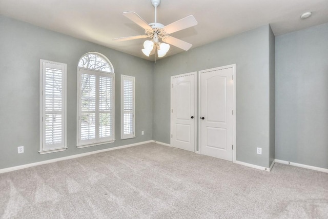 8016 Tahoe Parke Cir, Austin, TX 78726 - unfurnished bedroom with carpet flooring, baseboards, and a ceiling fan