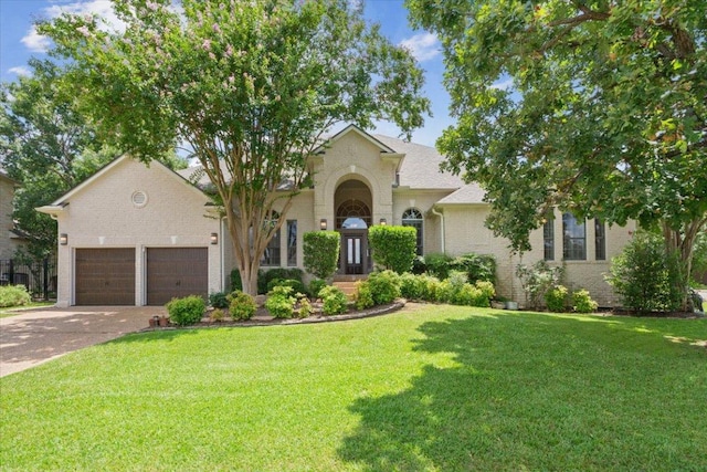 8016 Tahoe Parke Cir, Austin, TX 78726 - view of front facade with a front lawn, brick siding, driveway, and a garage