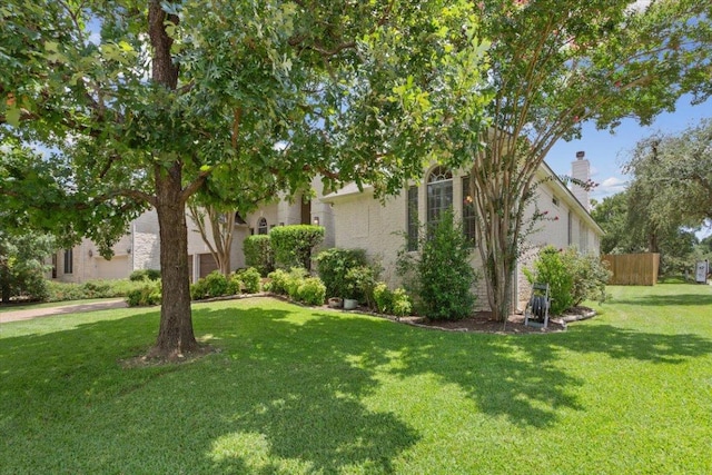 8016 Tahoe Parke Cir, Austin, TX 78726 - view of front of home with a front lawn and a chimney