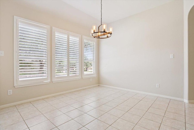 8016 Tahoe Parke Cir, Austin, TX 78726 - empty room featuring a chandelier, light tile patterned floors, and arched walkways