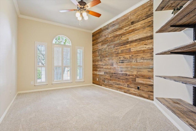8016 Tahoe Parke Cir, Austin, TX 78726 - carpeted empty room featuring wooden walls, ornamental molding, an accent wall, and a ceiling fan