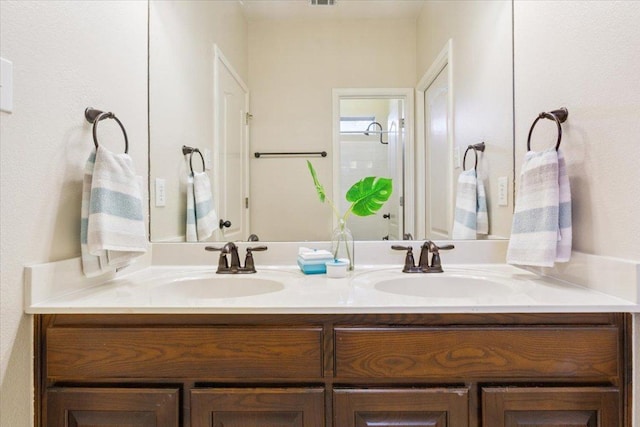 8016 Tahoe Parke Cir, Austin, TX 78726 - full bathroom featuring double vanity and a shower with door