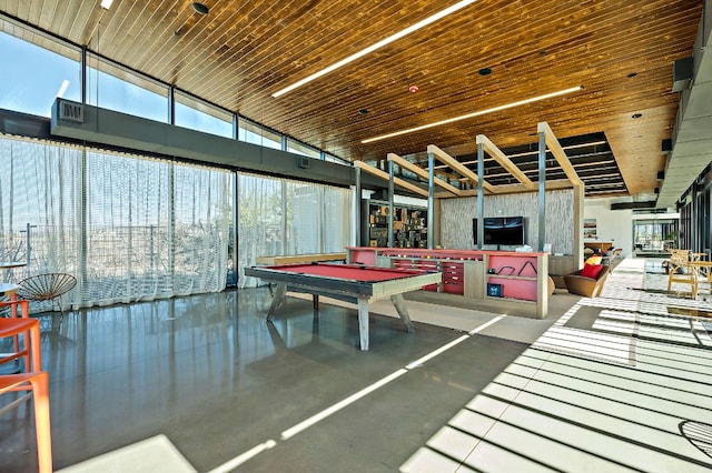 8112 Hubble Walk, Austin, TX 78744 - game room featuring a towering ceiling, expansive windows, billiards, and finished concrete floors