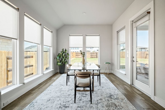 8112 Hubble Walk, Austin, TX 78744 - dining area with plenty of natural light, wood finished floors, lofted ceiling, and baseboards