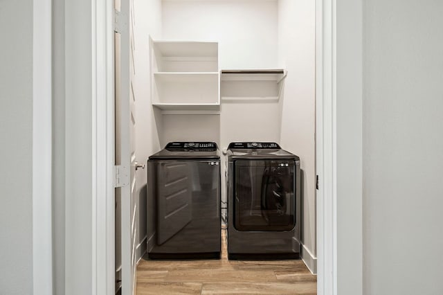 8112 Hubble Walk, Austin, TX 78744 - washroom featuring independent washer and dryer and light wood-type flooring