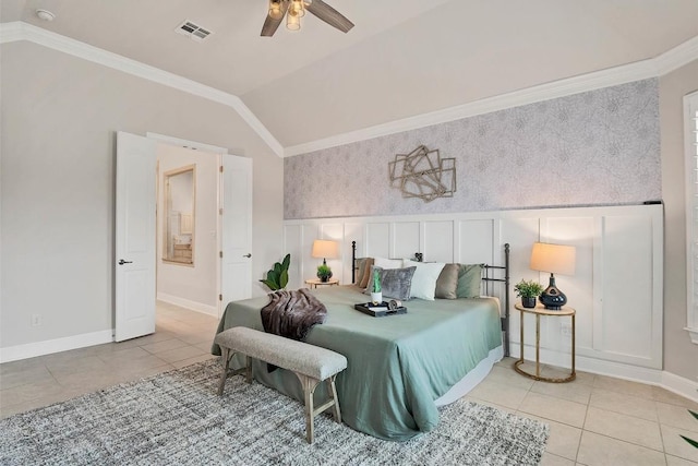 bedroom featuring crown molding, light tile patterned floors, vaulted ceiling, and visible vents