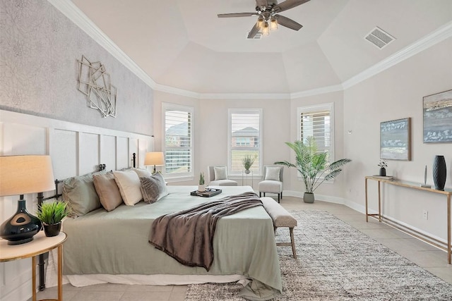 bedroom with a tray ceiling, light tile patterned floors, visible vents, and multiple windows