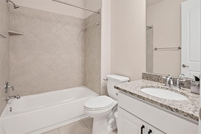 full bathroom featuring toilet, vanity, tile patterned flooring, and washtub / shower combination