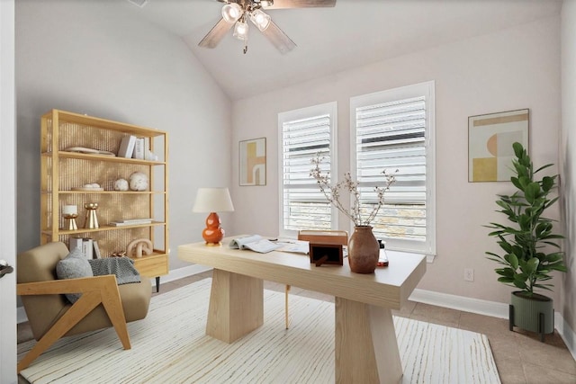 office featuring light tile patterned floors, ceiling fan, baseboards, and lofted ceiling