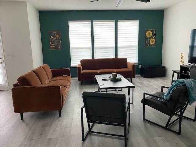 7900 Nightwing Rd, Austin, TX 78724 - living room with light wood-style floors and a ceiling fan
