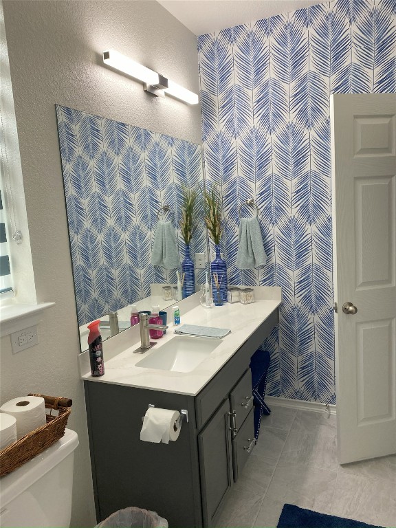7900 Nightwing Rd, Austin, TX 78724 - bathroom featuring toilet, vanity, and tile patterned floors