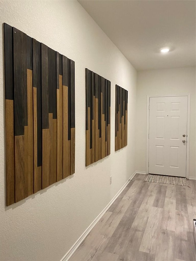 7900 Nightwing Rd, Austin, TX 78724 - hallway featuring baseboards and light wood finished floors